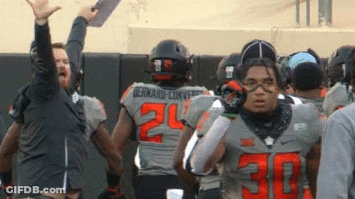 Football Player Number 30 In Front Of Group GIF