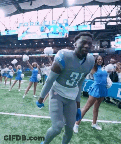 Football Player Number 31 With Cheerleaders GIF
