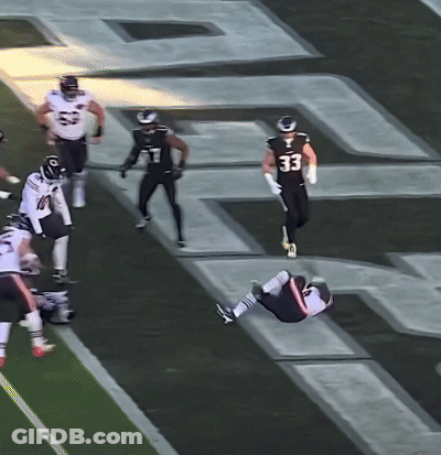 Football Player Number 33 Lying On Ground GIF