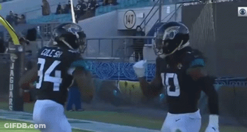 Football Player Number 34 Next To Another Player GIF