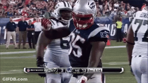 Football Player Number 35 Hugging Another Player GIF