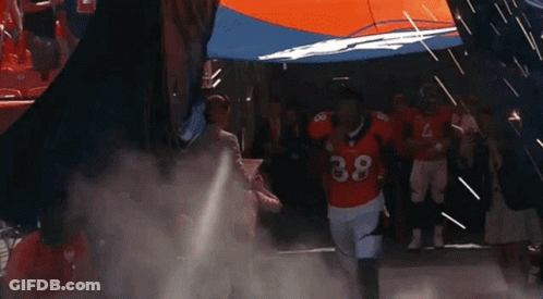 Football Player Number 38 Running Through Tunnel GIF