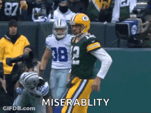 Football Player Number 38 Standing Next To Another Player GIF
