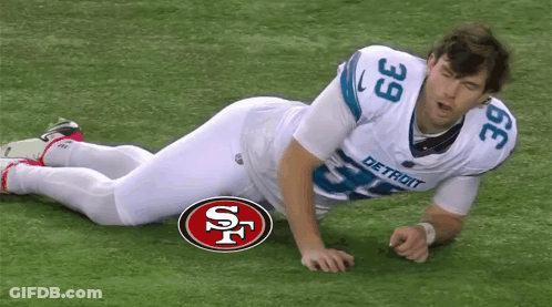 Football Player Number 39 Laying On Ground GIF