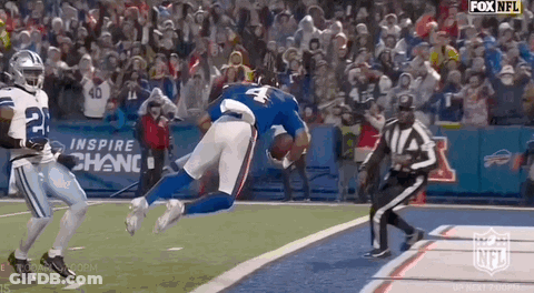 Football Player Number 4 Flying Through Air With Referee Watching GIF