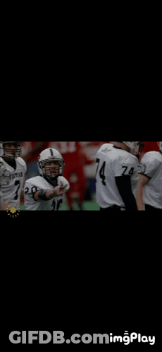 Football Player Number 4 In Huddle With Teammates GIF