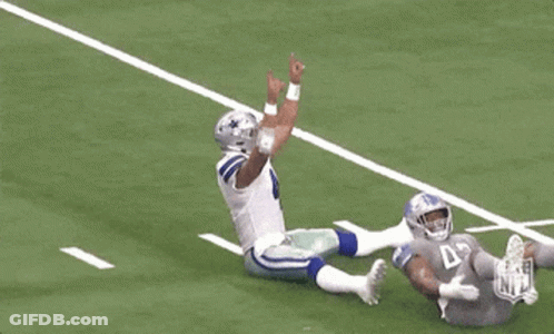 Football Player Number 4 Laying On Ground GIF