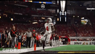 Football Player Number 4 Running On Field GIF