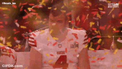 Football Player Number 4 Surrounded By Confetti GIF