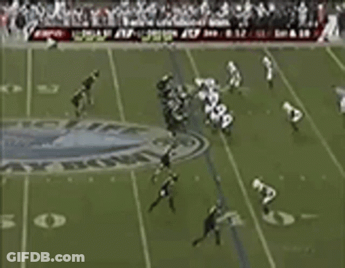 Football Player Number 4 Surrounded By Players GIF