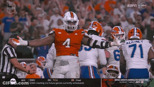 Football Player Number 4 Surrounded GIF