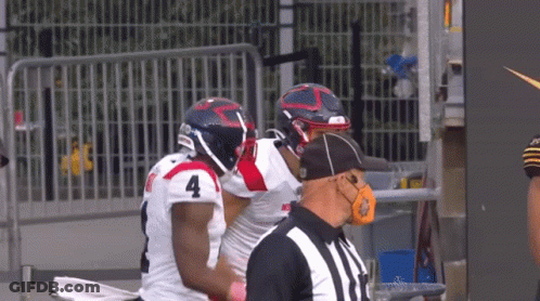 Football Player Number 4 Talking To Another Player GIF