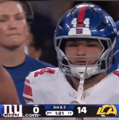 Football Player Number 44 In Front Of Scoreboard GIF