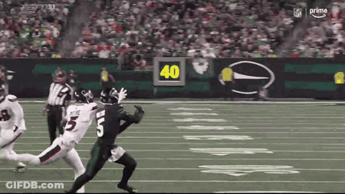 Football Player Number 5 Being Tackled GIF