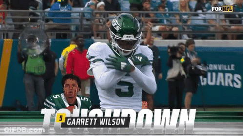 Football Player Number 5 Being Tackled GIF