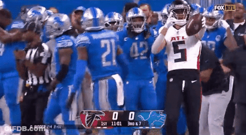 Football Player Number 5 In Front Of Group GIF