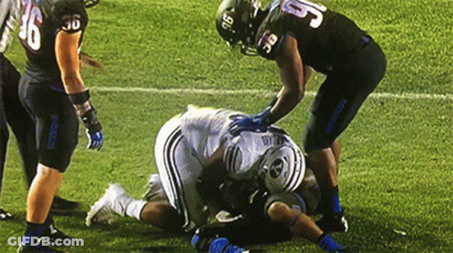 Football Player Number 5 Laying On Ground GIF