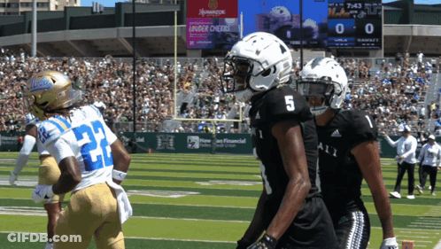 Football Player Number 5 Next To Another Player GIF