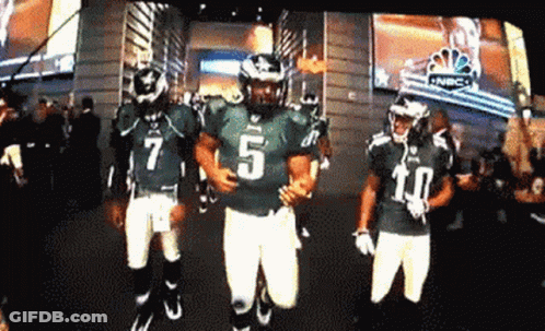 Football Player Number 5 Running With Teammates GIF