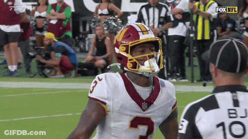 Football Player Number 5 Talking To Referee GIF