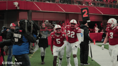 Football Player Number 5 Walking Off Field GIF