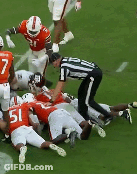 Football Player Number 51 Laying On Ground GIF