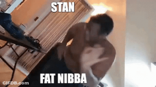 Football Player Number 52 Standing On Field GIF