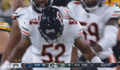 Football Player Number 52 With Teammates GIF