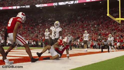 Football Player Number 6 Being Tackled GIF