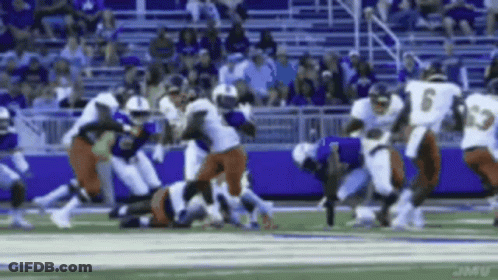 Football Player Number 6 Being Tackled GIF