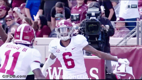 Football Player Number 6 Next To Another Player GIF