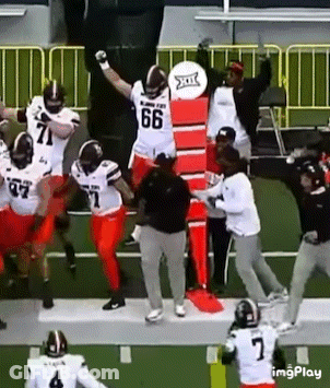 Football Player Number 66 On Field GIF