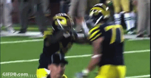 Football Player Number 7 Being Tackled GIF