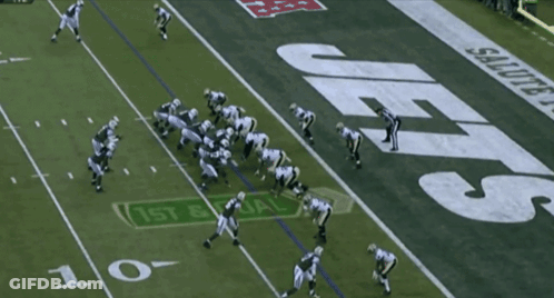 Football Player Number 7 Being Tackled GIF