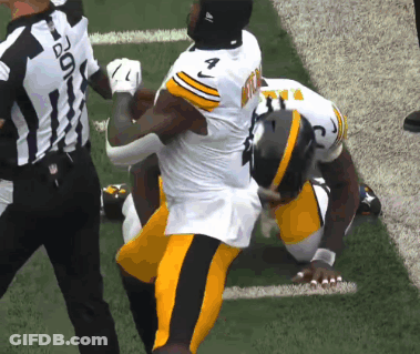 Football Player Number 7 Being Tackled GIF