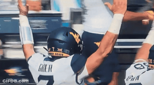 Football Player Number 7 Being Tackled GIF