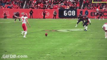 Football Player Number 7 Laying On Ground GIF