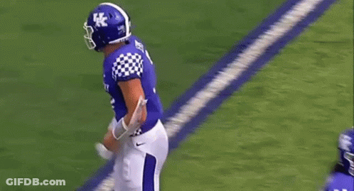 Football Player Number 7 Standing Next To Another GIF