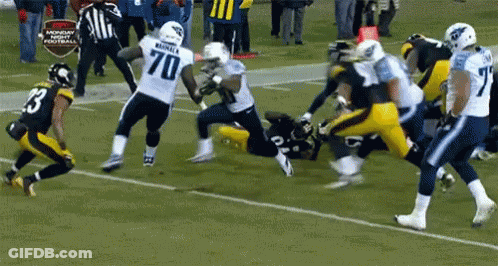 Football Player Number 70 Being Tackled GIF