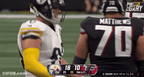 Football Player Number 70 Jersey Talking To Another Player GIF