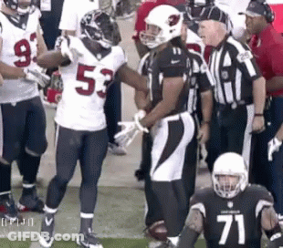 Football Player Number 71 Talking To Another Player GIF