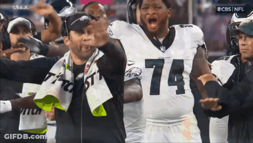 Football Player Number 74 In Front Of Crowd GIF