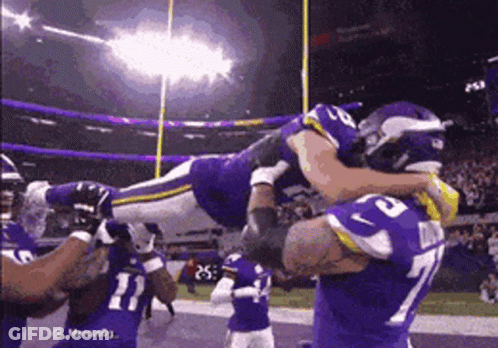 Football Player Number 77 Lifted In Air GIF