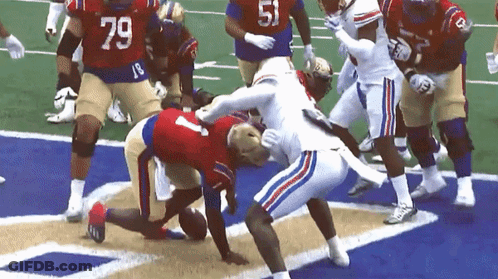 Football Player Number 79 Being Tackled GIF