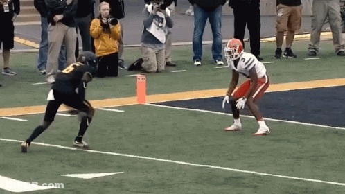 Football Player Number 8 Running At Another GIF