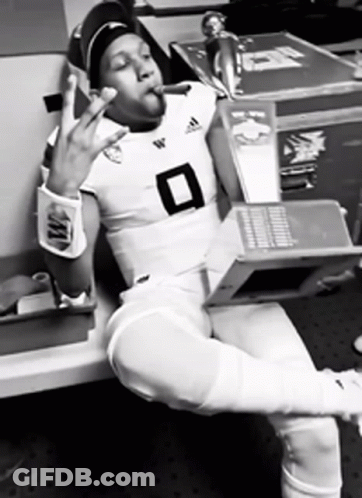 Football Player Number 8 Smoking Cigarette Holding Laptop GIF