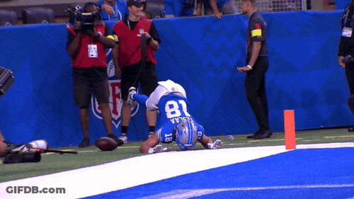 Football Player Number 81 Laying On Field GIF