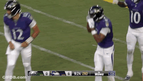 Football Player Number 81 Surrounded By Players GIF