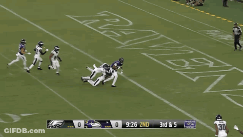 Football Player Number 81 Surrounded By Players GIF