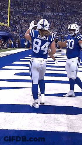Football Player Number 84 Congratulated By Teammate GIF